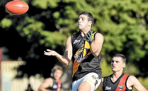 Toowoomba Tigers’ Max Richardson jumps for a mark during Saturday’s clash with South Toowoomba.