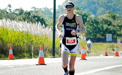 Fearless Ipswich competitor Kym Jaenke stays focused during the gruelling marathon leg of Sunday’s ironman event in Cairns. Fearless Ipswich competitor Kym Jaenke stays focused during the gruelling marathon leg of Sunday’s ironman event in Cairns.