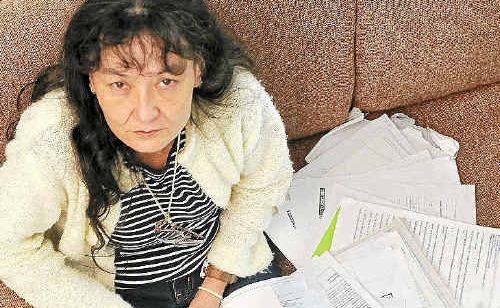 LEGAL ADVICE: Christine Anderson with some of the documentation related to the auction of her home after payment of her land rates had lapsed. LEGAL ADVICE: Christine Anderson with some of the documentation related to the auction of her home after payment of her land rates had lapsed.