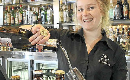 Bartender Caitlin Campbell shows off the pub’s beer variety and the now popular white wine. Bartender Caitlin Campbell shows off the pub’s beer variety and the now popular white wine.