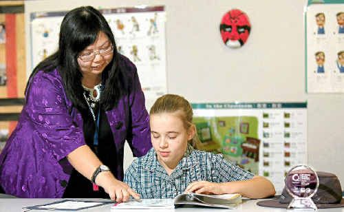 Heights College student Lize Nortje studied hard to win Mandarin with her teacher Jinyan Li. Heights College student Lize Nortje studied hard to win Mandarin with her teacher Jinyan Li.