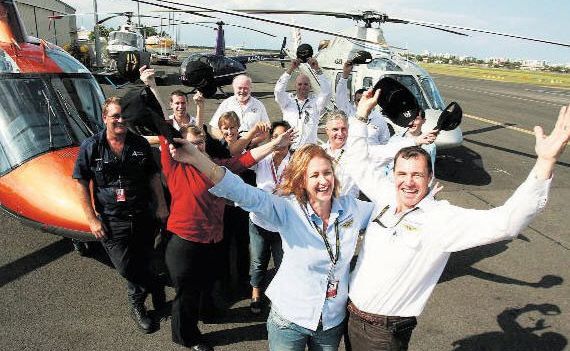Hooray: Jan and Mike Becker, front, from Becker Helicopters, winners of a 2010 excellence in business award. Hooray: Jan and Mike Becker, front, from Becker Helicopters, winners of a 2010 excellence in business award.