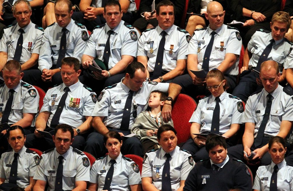 A moment from the funeral of Det Sen-Const Damian Leeding in 2011. A moment from the funeral of Det Sen-Const Damian Leeding in 2011.
