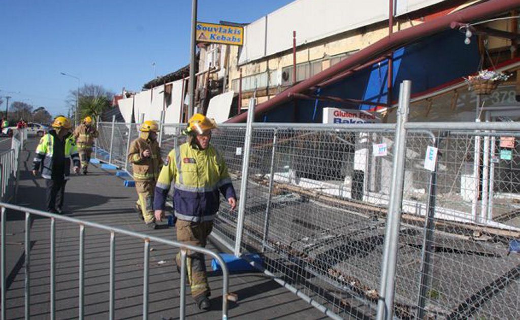 Fire service personnel examine the collapsed shops on Worcester Street. Fire service personnel examine the collapsed shops on Worcester Street.