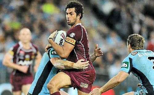 Queensland’s Dane Nielsen charges into NSW’s Mark Gasnier and Beau Scott in Sydney. Queensland’s Dane Nielsen charges into NSW’s Mark Gasnier and Beau Scott in Sydney.
