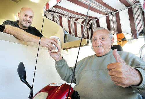 Vince Rovere serves Dennis Coulson at the grand opening of the Hervey Bay Toast Espresso Bar - the shop has a drive-in window for mobility scooters. Vince Rovere serves Dennis Coulson at the grand opening of the Hervey Bay Toast Espresso Bar - the shop has a drive-in window for mobility scooters.