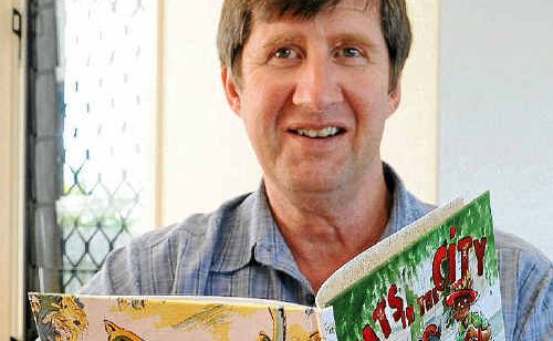 Daniel Hevenor with his children’s book titled Cats in the City. Daniel Hevenor with his children’s book titled Cats in the City.