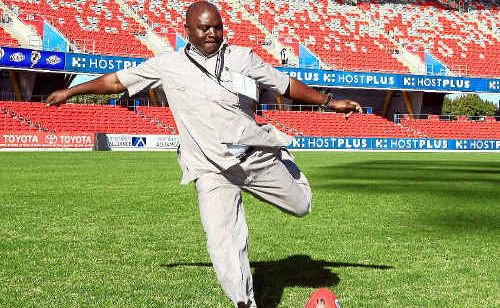 Jappie Mhango tests the playing surface of Metricon Stadium. 