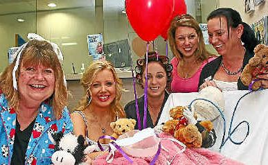 Lynda Jones, Steph Castree, Kylie Kneebone, Suzie Knight and Sonia Shead at work in their PJs in support of the BOQ Banking on our Kids’ fundraiser for the Children’s Hospital Foundation Australia. Lynda Jones, Steph Castree, Kylie Kneebone, Suzie Knight and Sonia Shead at work in their PJs in support of the BOQ Banking on our Kids’ fundraiser for the Children’s Hospital Foundation Australia.