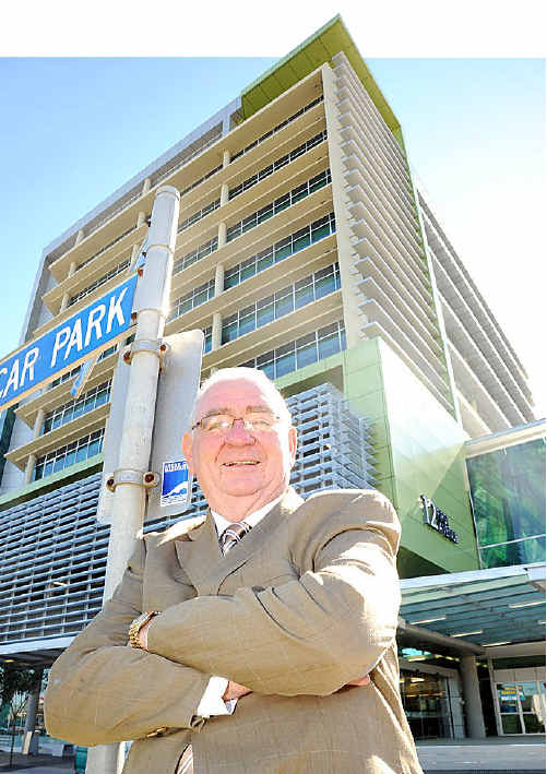 Former Premier Mike Ahern in front of the government office building named after him. Former Premier Mike Ahern in front of the government office building named after him.