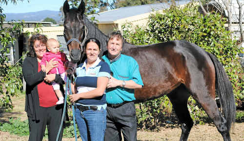 Garry Schwenke (right) with wife Joann (left), grand daughter Lacey and daughter Haleigh wish racehorse Cuban good luck for this weekend in the Queensland Cup. Garry Schwenke (right) with wife Joann (left), grand daughter Lacey and daughter Haleigh wish racehorse Cuban good luck for this weekend in the Queensland Cup.