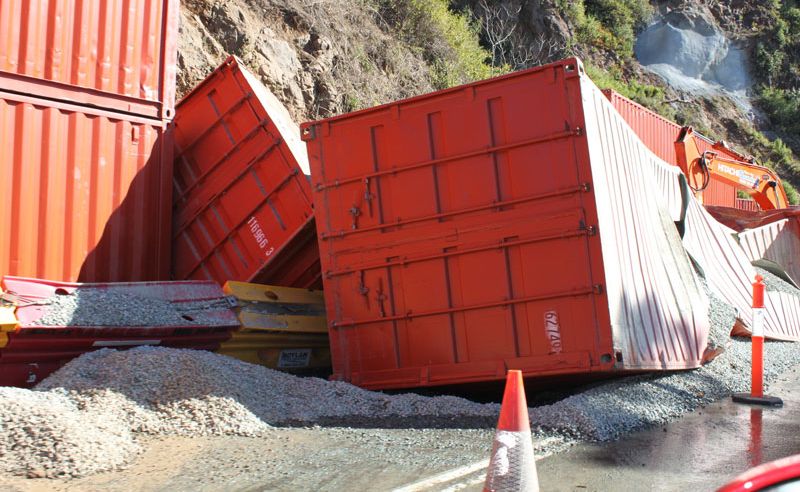 No-one was injured when a large boulder toppled onto two shipping containers yesterday. No-one was injured when a large boulder toppled onto two shipping containers yesterday.