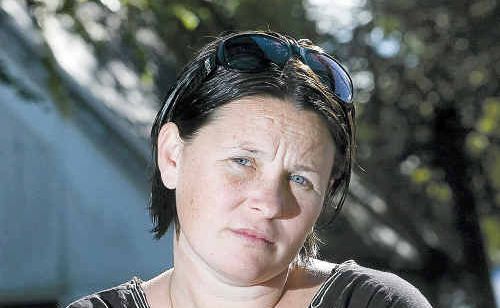 Linda Foster, of Casino, poses after purchasing a six-pack of pre-mixed Bundaberg Rum and Cola and later finding out that one of the cans allegedly had a mouse inside. Linda Foster, of Casino, poses after purchasing a six-pack of pre-mixed Bundaberg Rum and Cola and later finding out that one of the cans allegedly had a mouse inside.