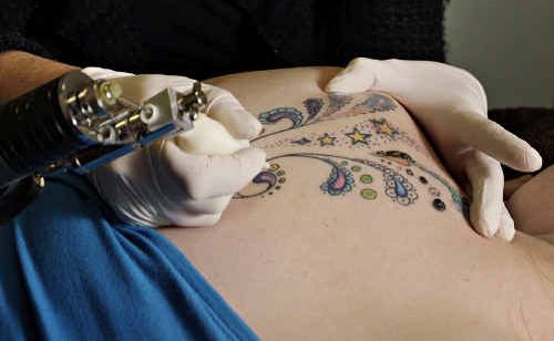 Julie Simmons of Beauty Spot Day Spa, Marcoola, removes a tattoo from “Elise”. Julie Simmons of Beauty Spot Day Spa, Marcoola, removes a tattoo from “Elise”.