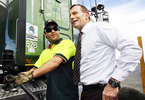 Opposition leader Tony Abbott chats to Nolan’s Transport truck driver Brenton Herrmann about the government’s proposed carbon tax implications for haulage companies.