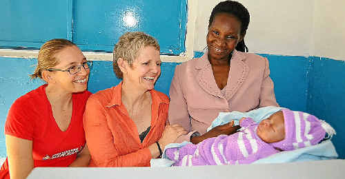 Midwives Natarsha Jazepczyk (left) and Vicki Chan with mother Dorothy and her new baby Amos at the Fremo Medical Clinic in Nairobi. Midwives Natarsha Jazepczyk (left) and Vicki Chan with mother Dorothy and her new baby Amos at the Fremo Medical Clinic in Nairobi.