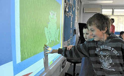 Byron Perdikis and Jolan Ormrod use an interactive whiteboard computer also used in music therapy at nambour Special School. Byron Perdikis and Jolan Ormrod use an interactive whiteboard computer also used in music therapy at nambour Special School.