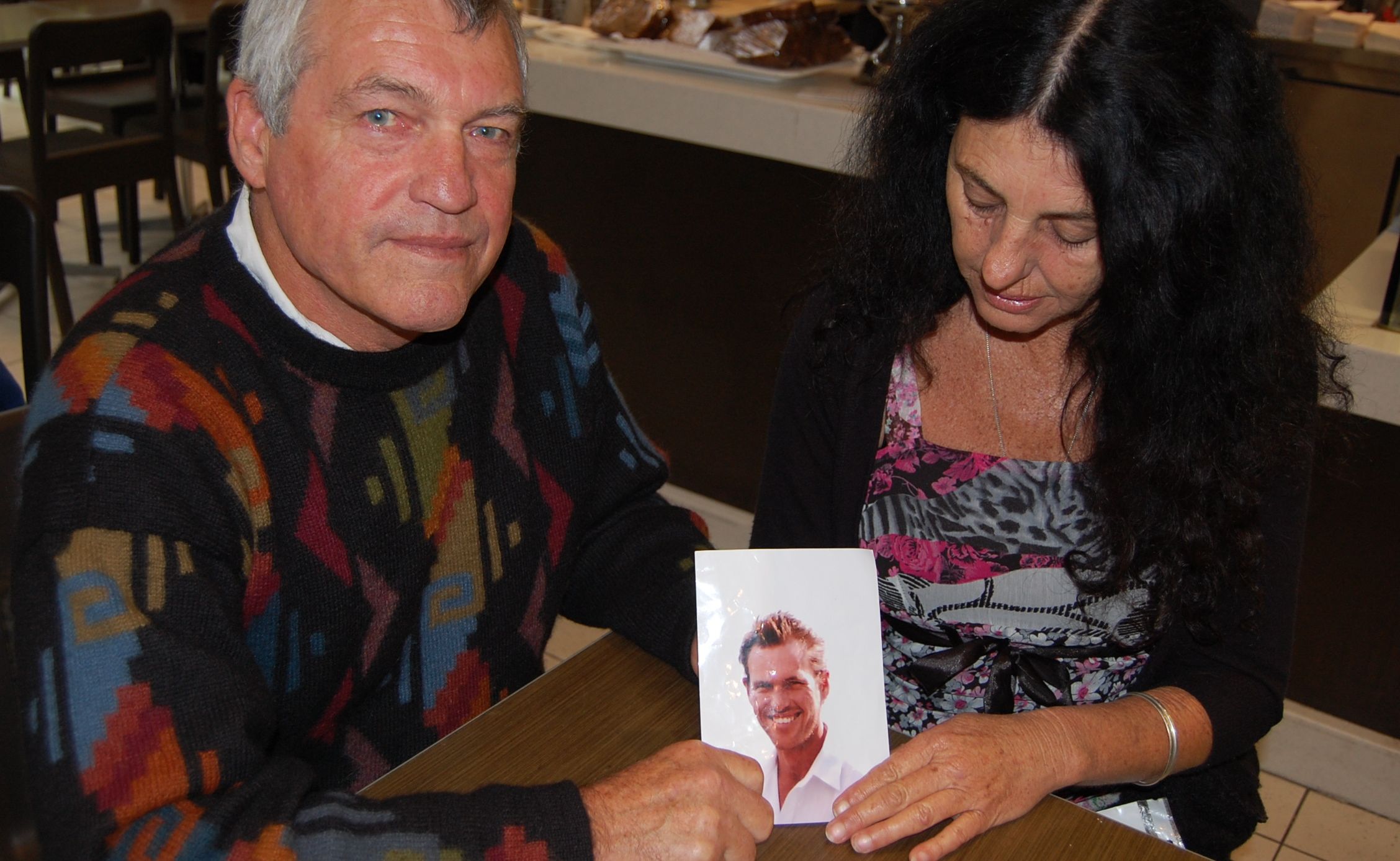 DEEP GRIEF: Ken Tapping and his wife Susan Smith hold a photograph of their son Lee Tapping, who was killed in a Grafton worksite accident in 2008. Photo: CFMEU. DEEP GRIEF: Ken Tapping and his wife Susan Smith hold a photograph of their son Lee Tapping, who was killed in a Grafton worksite accident in 2008. Photo: CFMEU.