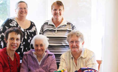 Linda Gibson of the Department of Communities with Lesley Pollard, Alice Meharry, Jenni Bowerman and Norma Tasker and some of their cosy creations. Linda Gibson of the Department of Communities with Lesley Pollard, Alice Meharry, Jenni Bowerman and Norma Tasker and some of their cosy creations.