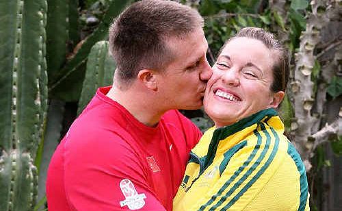 Ipswich Olympian Deborah Acason receives a kiss from husband Joshua at their Dinmore home. Ipswich Olympian Deborah Acason receives a kiss from husband Joshua at their Dinmore home.