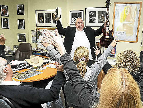 Bluesfest director Peter Noble in his new role as an evangelistic religious leader of the Church of the Helping Hand preaching to his followers in his Bluesfest revival centre. Bluesfest director Peter Noble in his new role as an evangelistic religious leader of the Church of the Helping Hand preaching to his followers in his Bluesfest revival centre.
