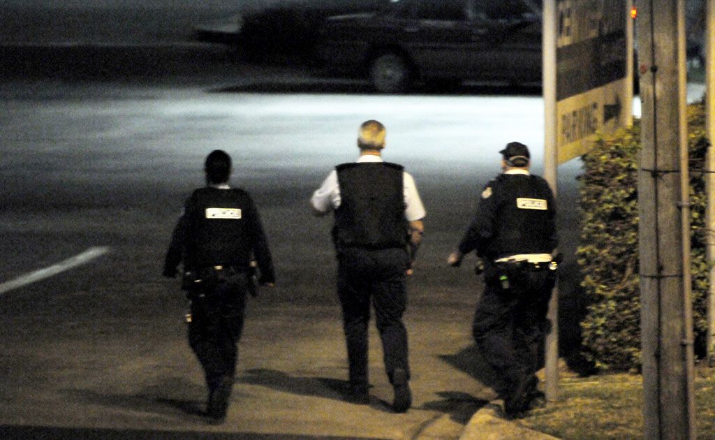 Police wearing bulletproof vests take position near BCF. Police wearing bulletproof vests take position near BCF.