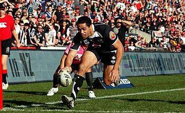Bill Tupou scores in the corner against the Canberra Raiders. Bill Tupou scores in the corner against the Canberra Raiders.