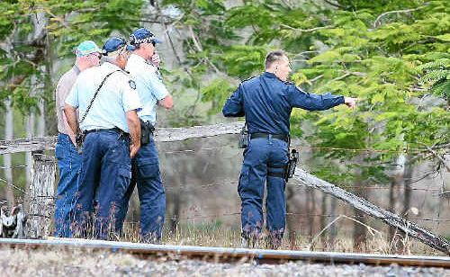 Police check an area near Lakes Creek Road after a man tried to hold up a store on Little Musgrave St yesterday. Police check an area near Lakes Creek Road after a man tried to hold up a store on Little Musgrave St yesterday.