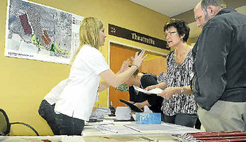 Ballot official Laureen Creevey helps Sheila and Richard Cork lodge their preferences for the Grantham land swap deal. Ballot official Laureen Creevey helps Sheila and Richard Cork lodge their preferences for the Grantham land swap deal.