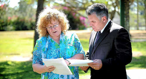 Eleonor Lambert and Member for Burnett Rob Messenger go through documentation relative to her surgery. Eleonor Lambert and Member for Burnett Rob Messenger go through documentation relative to her surgery.