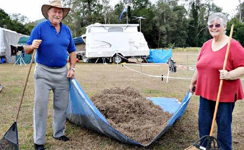 Stewart and Annette Muir rake their site before setting up camp at Amamoor. Stewart and Annette Muir rake their site before setting up camp at Amamoor.