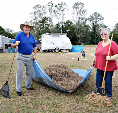 Stewart and Annette Muir rake their site before setting up camp at Amamoor. Stewart and Annette Muir rake their site before setting up camp at Amamoor.