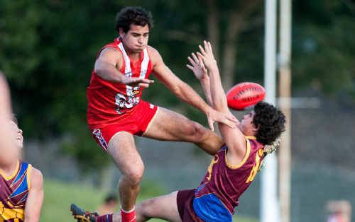 Coffs Swans ruckman makes a spectacular attempt to spoil a mark by Nambucca Valley’s Jacob Howden in Saturday’s AFL North Coast 1st semi final. 