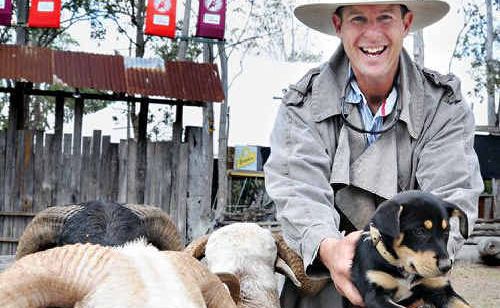 Sean Barrett promotes the Pre Muster Party with his working dog in training – a kelpie pup – and a herd of small livestock mustered through Amamoor Creek campgrounds. Sean Barrett promotes the Pre Muster Party with his working dog in training – a kelpie pup – and a herd of small livestock mustered through Amamoor Creek campgrounds.