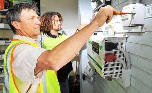 Brett Randall and Rhys Andrews installing extra solar inverters for North Coast Power and Water, which generates all its own power for its Coffs Harbour premises. Brett Randall and Rhys Andrews installing extra solar inverters for North Coast Power and Water, which generates all its own power for its Coffs Harbour premises.