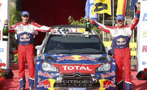 IMPORTANT WIN: French Sebastien Ogier, right, and co-pilot Julien Ingrassa celebrate on the podium after winning the Rallye Deutschland in Trier, Germany. AP IMPORTANT WIN: French Sebastien Ogier, right, and co-pilot Julien Ingrassa celebrate on the podium after winning the Rallye Deutschland in Trier, Germany. AP