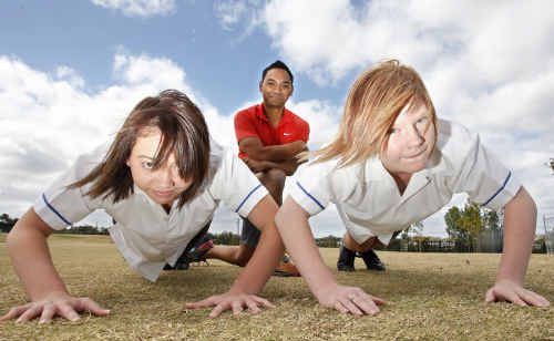 Personal trainer Larry McCulloch (back), with year 9 Bremer State High School students Tyra Fox and Brittany List, is on a mission to get Ipswich’s young people fit. Personal trainer Larry McCulloch (back), with year 9 Bremer State High School students Tyra Fox and Brittany List, is on a mission to get Ipswich’s young people fit.