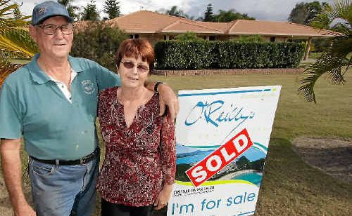 Joe and Lorraine Challacombe stand outside their newly bought home after moving in a week ago. Joe and Lorraine Challacombe stand outside their newly bought home after moving in a week ago.