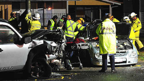 Emergency crews at the scene of the fatal crash in Maryborough on Tuesday night. Emergency crews at the scene of the fatal crash in Maryborough on Tuesday night.