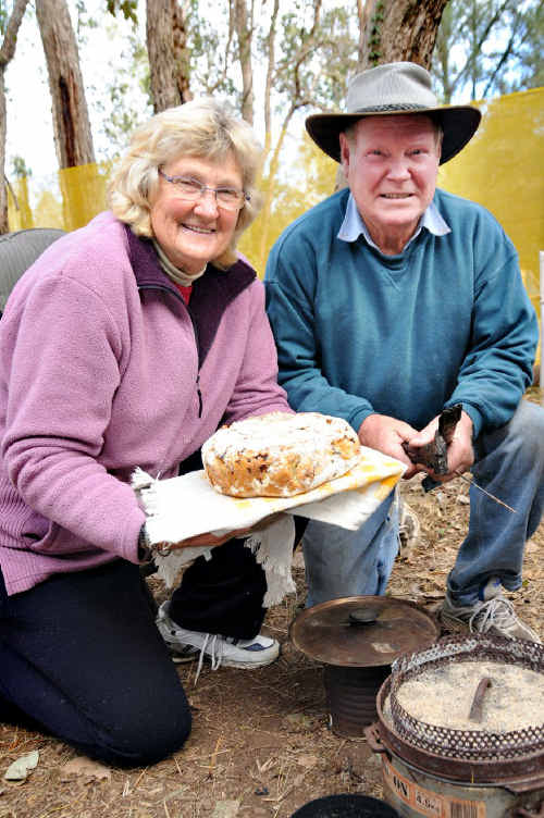 Jan and Claude McLachlan cooking up some Muster damper.