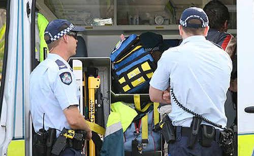 Police and paramedics attend the scene of a dog attack at Raceview yesterday, where a man was injured. Police and paramedics attend the scene of a dog attack at Raceview yesterday, where a man was injured.
