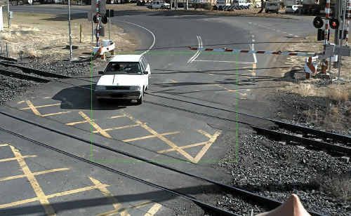 This picture of a motorist weaving around the lowered boom gate at a crossing in CQ has been provided to police. This picture of a motorist weaving around the lowered boom gate at a crossing in CQ has been provided to police.