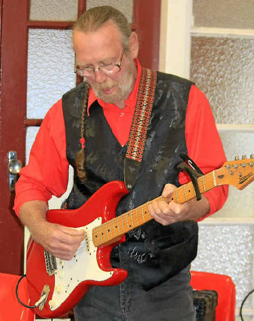 Local musician Alan Taylor warms up in preparation for this weekend’s concert.