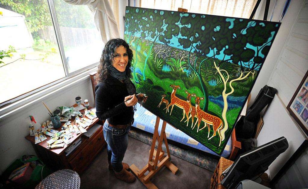 CAP: LANDSCAPE CREATURES: Sculptor and artist Violetta Lanza completing one of her paintings for the Club Coffs show. CAP: LANDSCAPE CREATURES: Sculptor and artist Violetta Lanza completing one of her paintings for the Club Coffs show.
