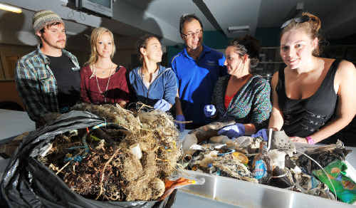 Marine science students (from left) Karl Goodsell, Aisling Hall, Ana Markic, Alysha Sozou and Amelia Bissell sort beach rubbish with Professor Stephen Smith. Marine science students (from left) Karl Goodsell, Aisling Hall, Ana Markic, Alysha Sozou and Amelia Bissell sort beach rubbish with Professor Stephen Smith.