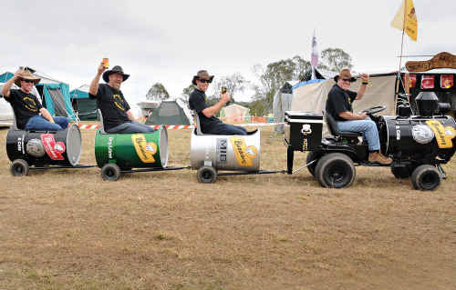 On the Black Rattler, a clever invention doing the rounds at this year’s Optus Music Muster, are (right to left) Al Willcox, Justin Willcox, Dave Payne and Ben Willcox. The Black Rattler may not reach the pace of its Valley Rattler cousin, but the inventors say at a walking speed, it’s great for enjoying a drink or two.