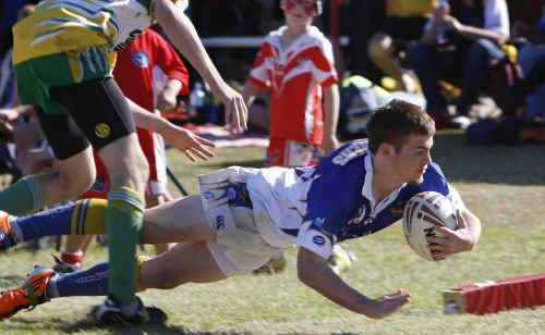 Jeremy Titmarsh slides in for Middlemount in the under-16 semi final with Clermont. Jeremy Titmarsh slides in for Middlemount in the under-16 semi final with Clermont.