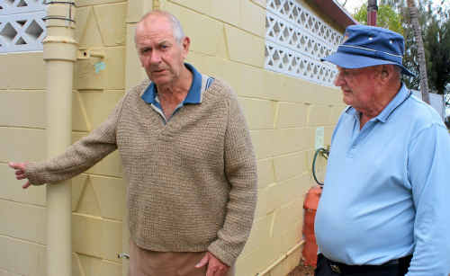 Ron Bishop and John Turnbull at one of the amenities blocks at the Beachside Caravan Park which has severe paint peeling on the inside and out due what these men say is lack of maintenance. Ron Bishop and John Turnbull at one of the amenities blocks at the Beachside Caravan Park which has severe paint peeling on the inside and out due what these men say is lack of maintenance.