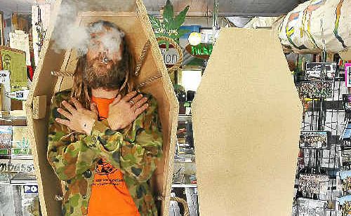 A Nimbin resident strikes a pose in the first hemp coffin produced by the Nimbin Hemp Embassy. A Nimbin resident strikes a pose in the first hemp coffin produced by the Nimbin Hemp Embassy.