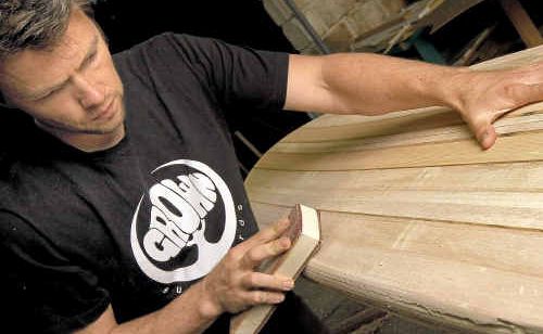 Grown Surfboards founder Andrew Wells with a new wooden surfboard creation. www.craigparry.com.au Grown Surfboards founder Andrew Wells with a new wooden surfboard creation. www.craigparry.com.au